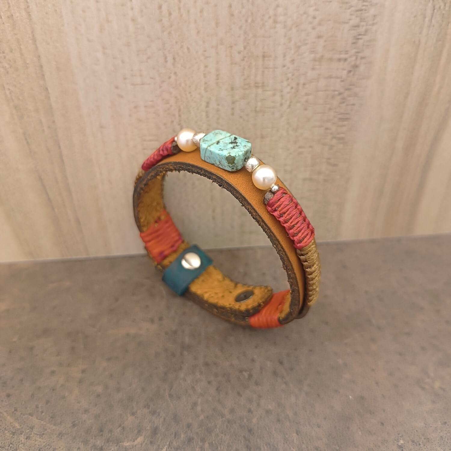 African Turquoise Bracelet Side angle showcasing braided cords, leather texture, and stud button detail