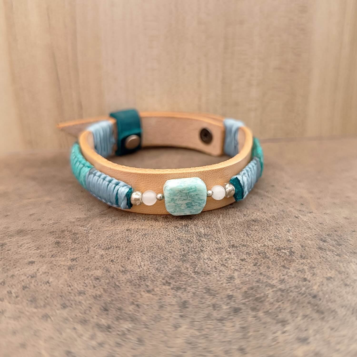 Amazonite leather bracelet with braided cord – full front view on leather surface