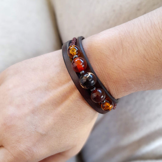 The Amber & Carnelian Beaded Leather Cuff worn on a wrist, demonstrating its masculine elegance and comfortable fit.