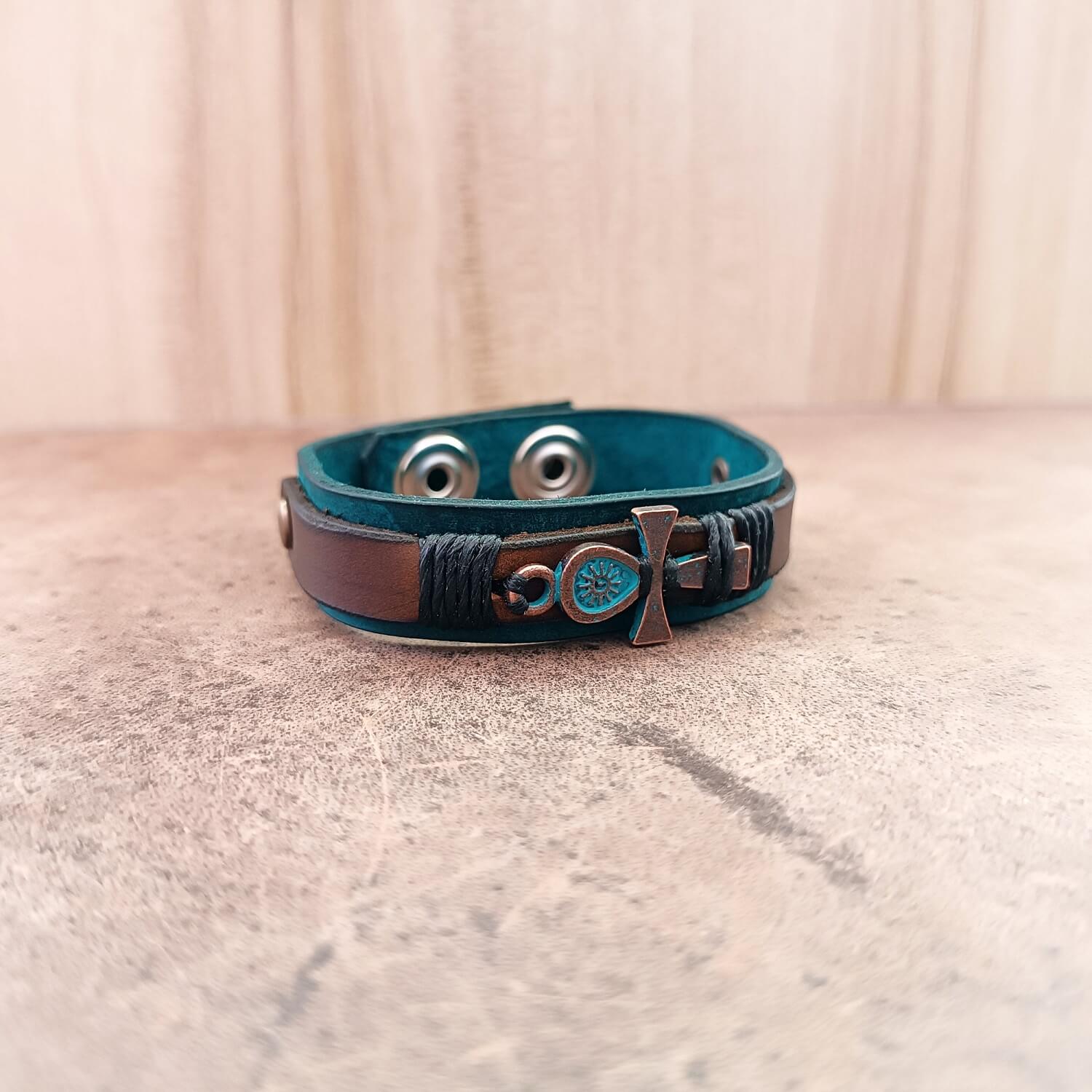 Unisex leather bracelet with antique bronze Ankh pendant flat view