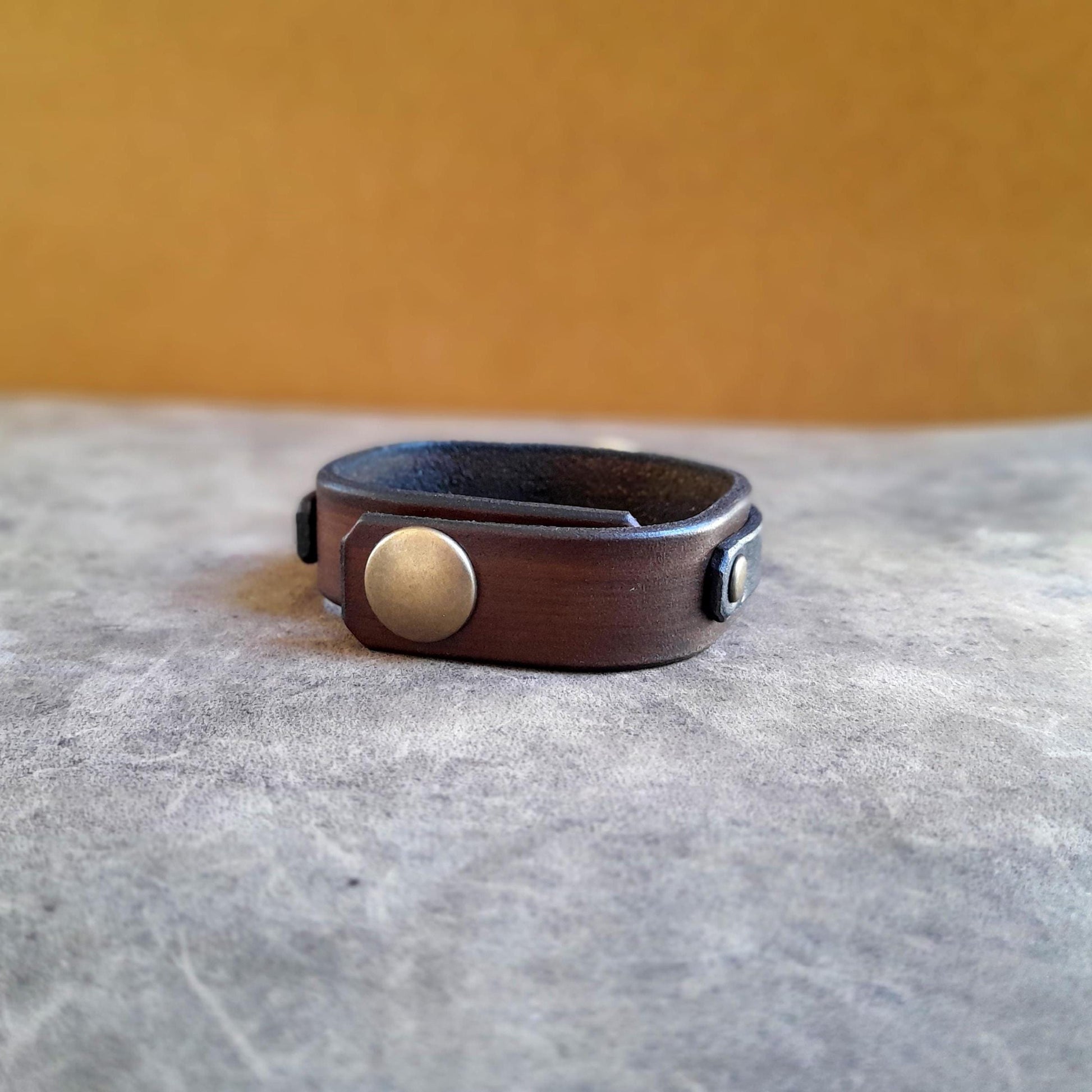 Back View of the Adjustable stainless steel snap closure on scarab bracelet with bronze cap.
