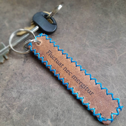 The back of the Hand Painted Forget Me Not Personalized Leather Keychain, displaying the area available for optional free text personalization.