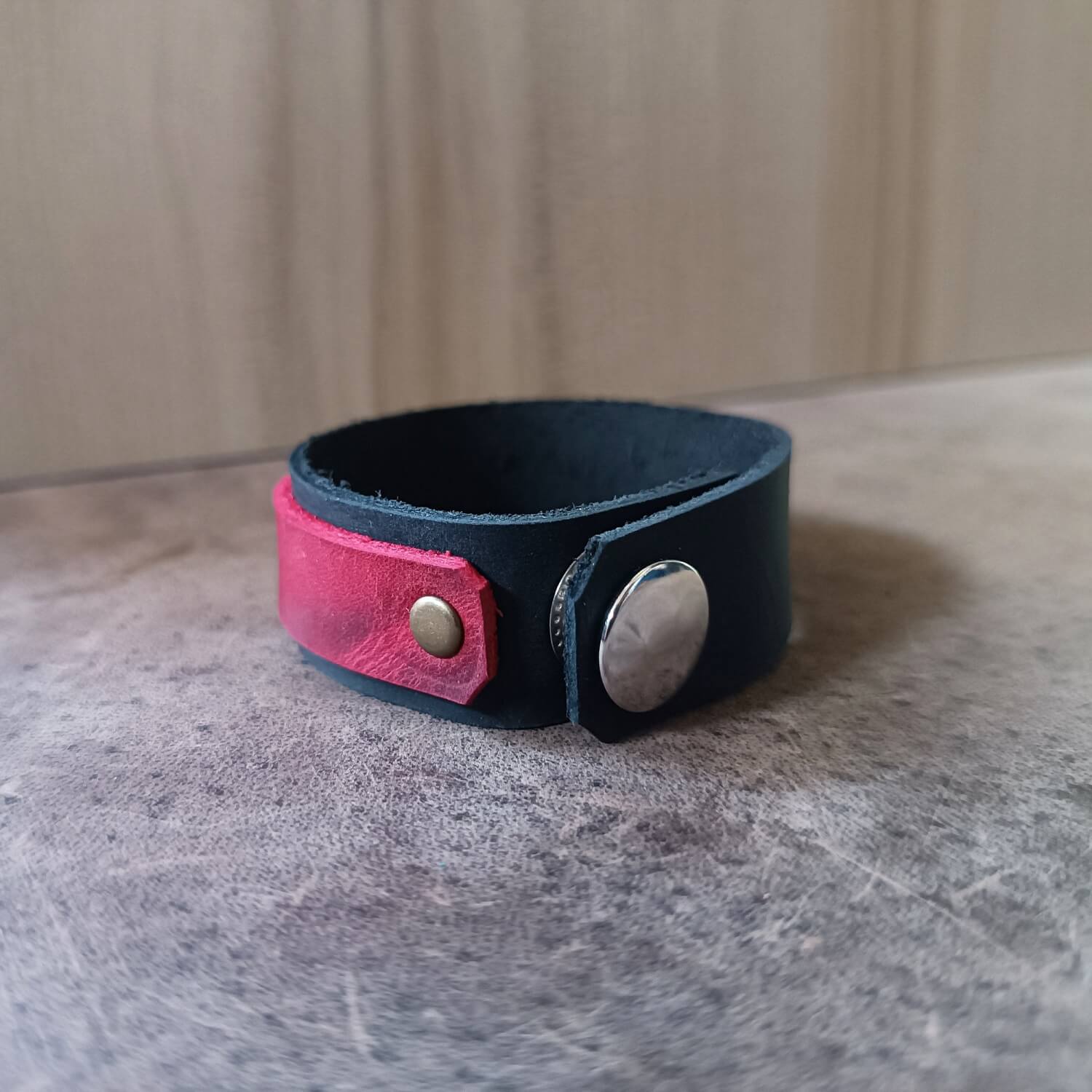 Back View of Vermilion bracelet showing leather texture and adjustable snap buttons