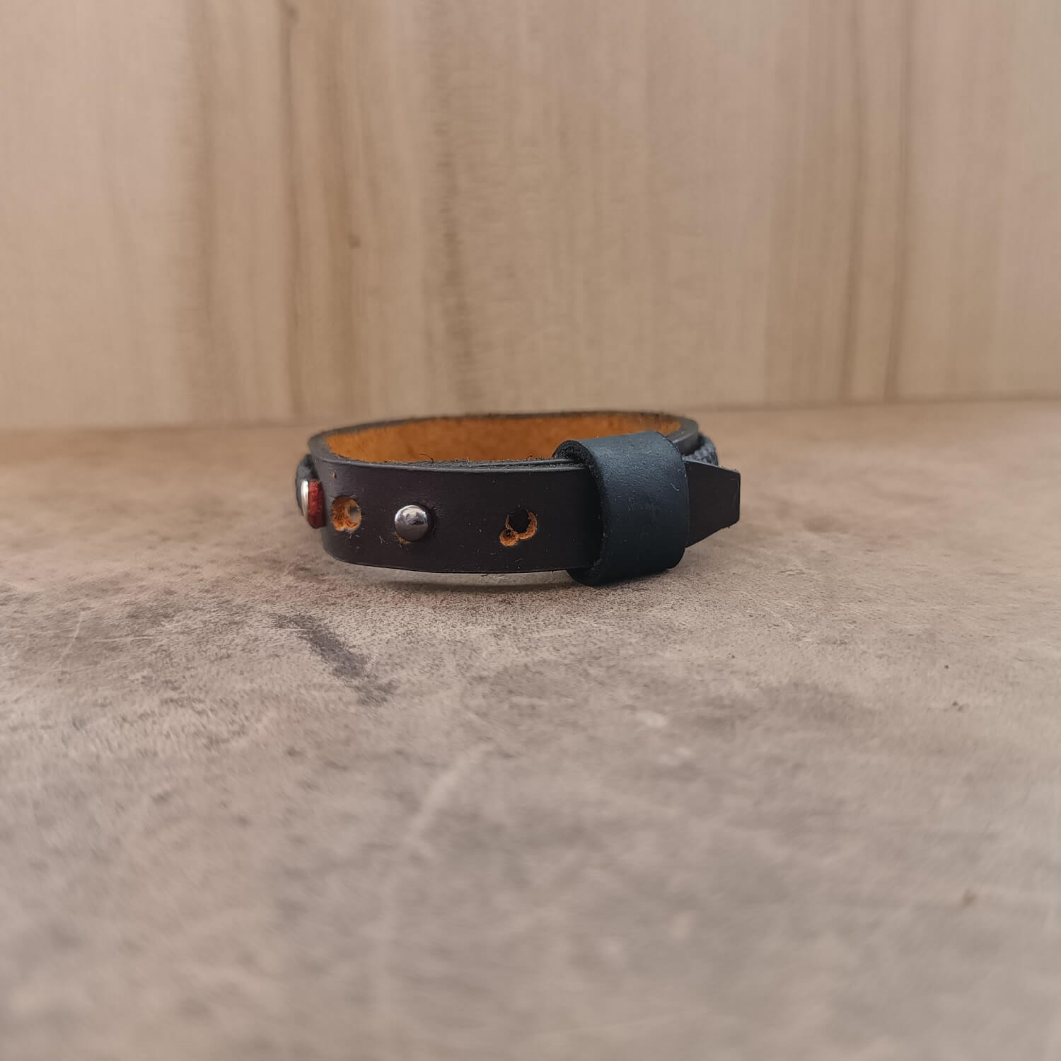 Back view of The Roamer Leather Bracelet, showing its adjustable stud button closure with multiple openings, demonstrating the secure and comfortable fit.