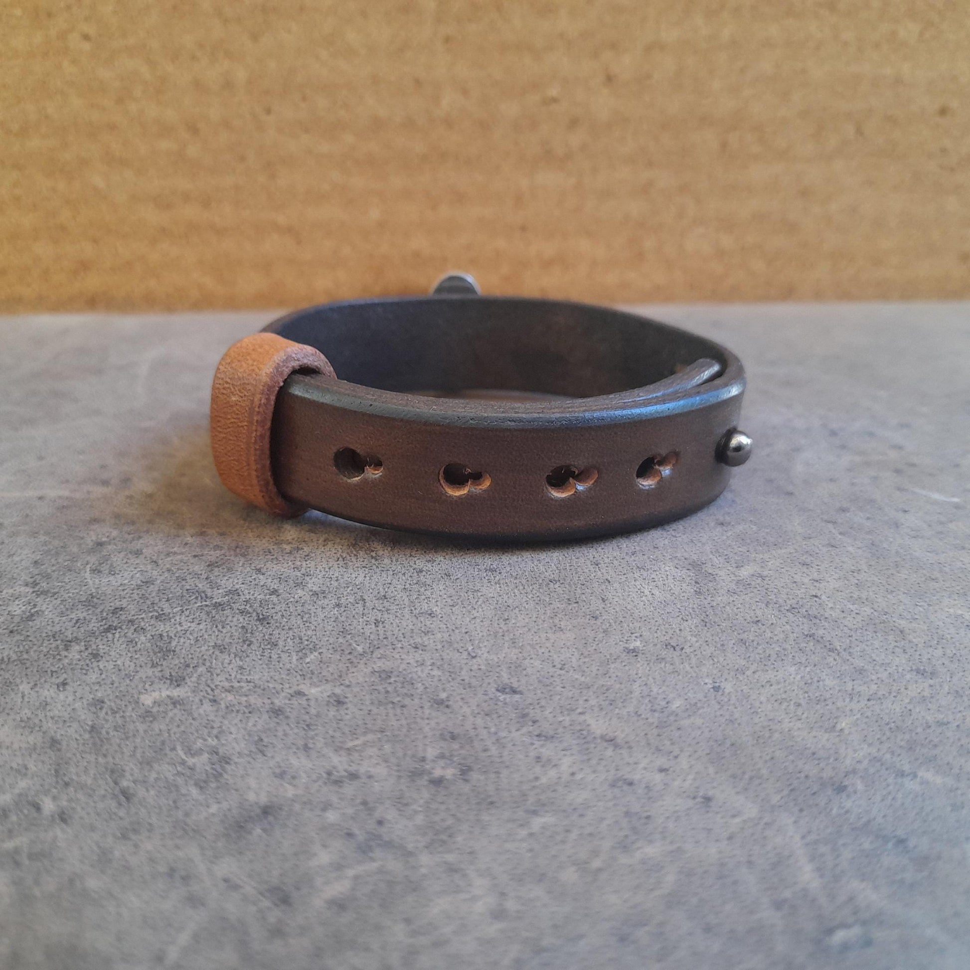 Back view of the Nephrite Jade leather bracelet, showing leather and adjustable openings.