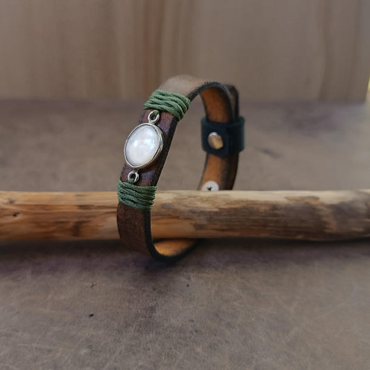 Moonstone Leather Wrap Bracelet side view, showcasing the adjustable fit and the elegant glow of the natural moonstone against the dark brown leather. Handmade by Lucky Seven Leather.