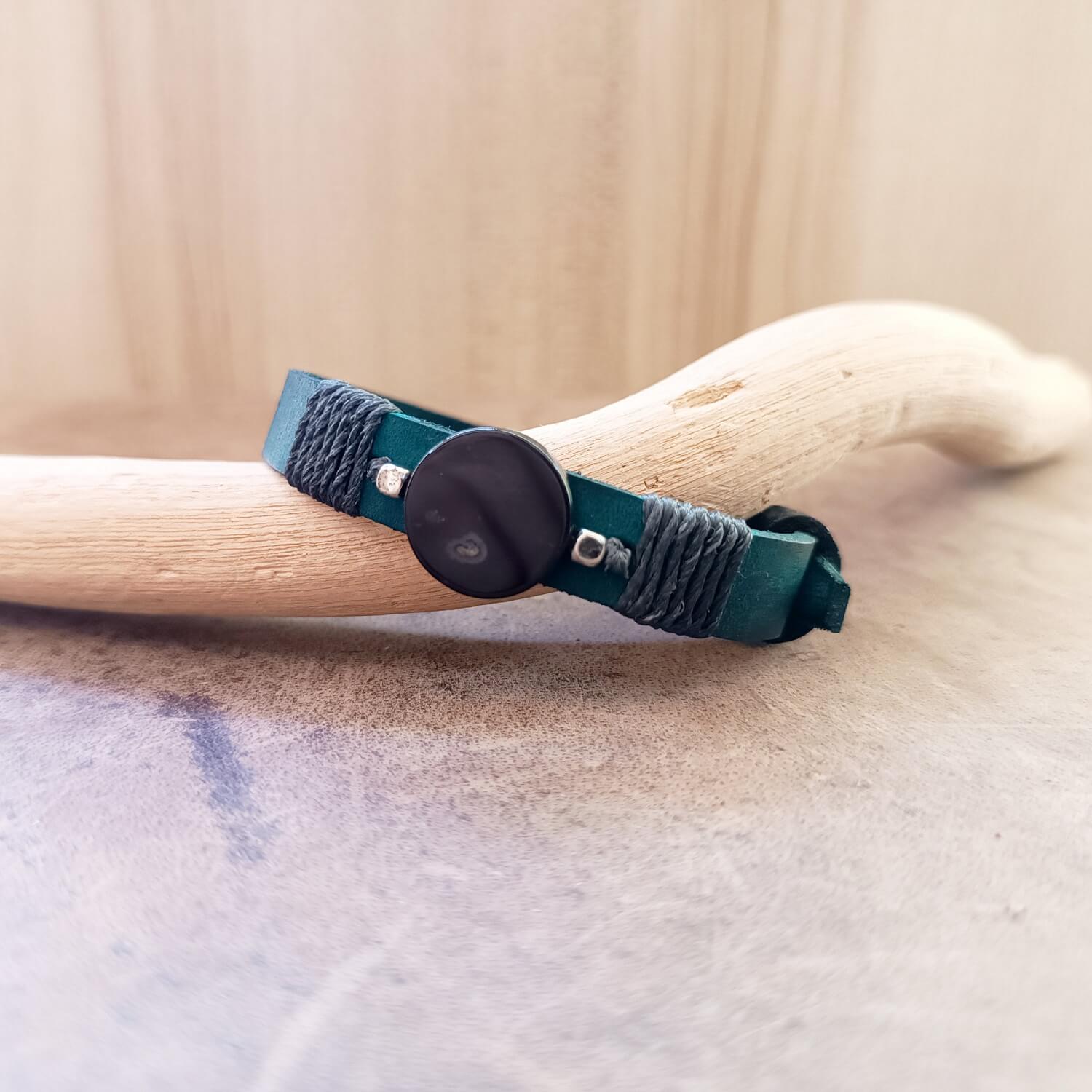 Black Agate and petrol blue leather bracelet in flat lay showing stone and cord wrap