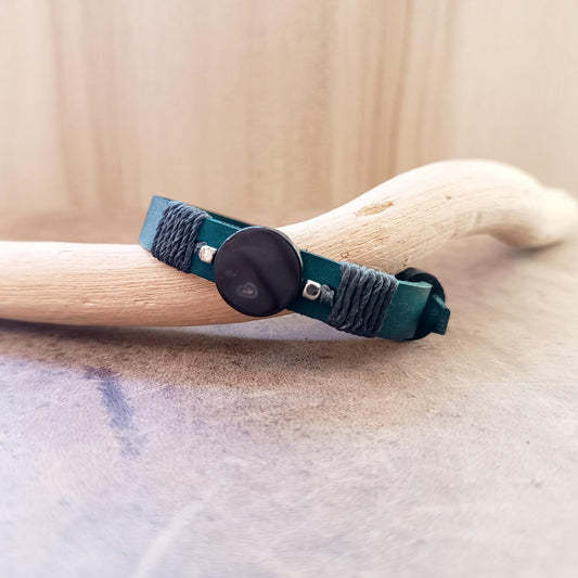 Black Agate and petrol blue leather bracelet in flat lay showing stone and cord wrap