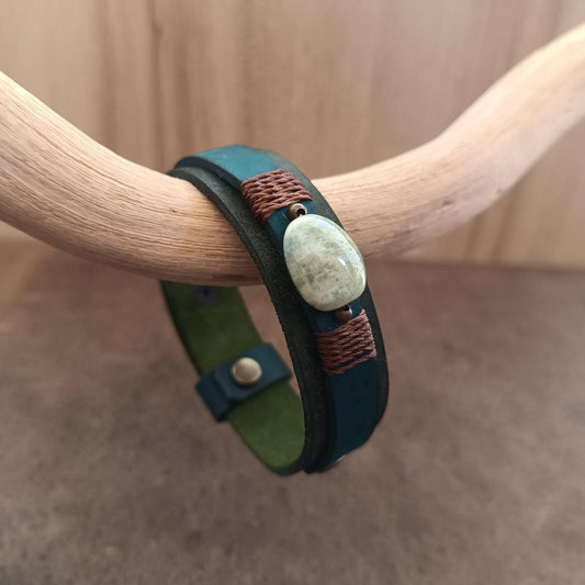 Close up of the Moss green and petrol blue leather bracelet with Bowenite stone centerpiece