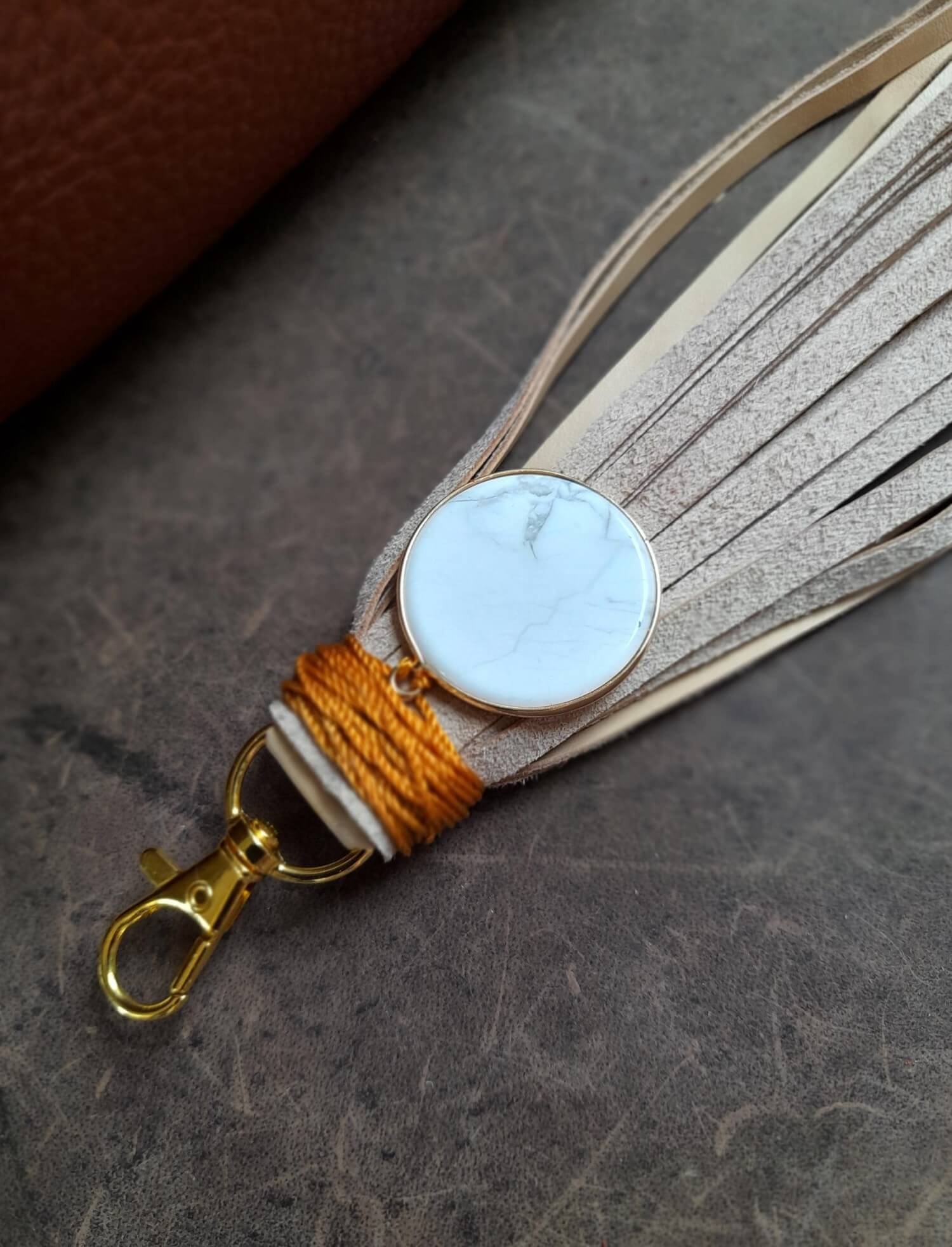 Detailed close-up of the large Howlite disc pendant on the Serene Howlite Charm, highlighting its smooth texture, soft white color, and unique gray veining.