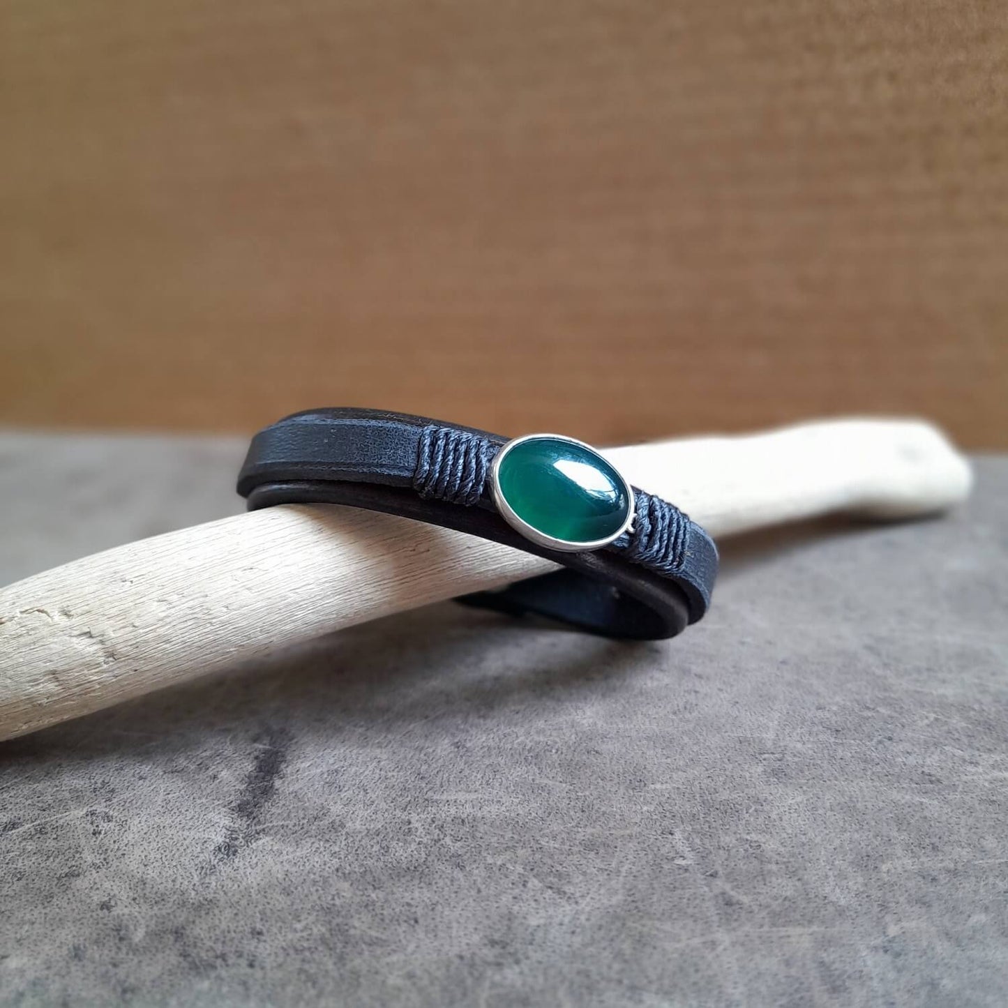 Detailed close-up of the rare natural dark green aventurine stone on the bracelet, highlighting its deep color and shimmering surface.