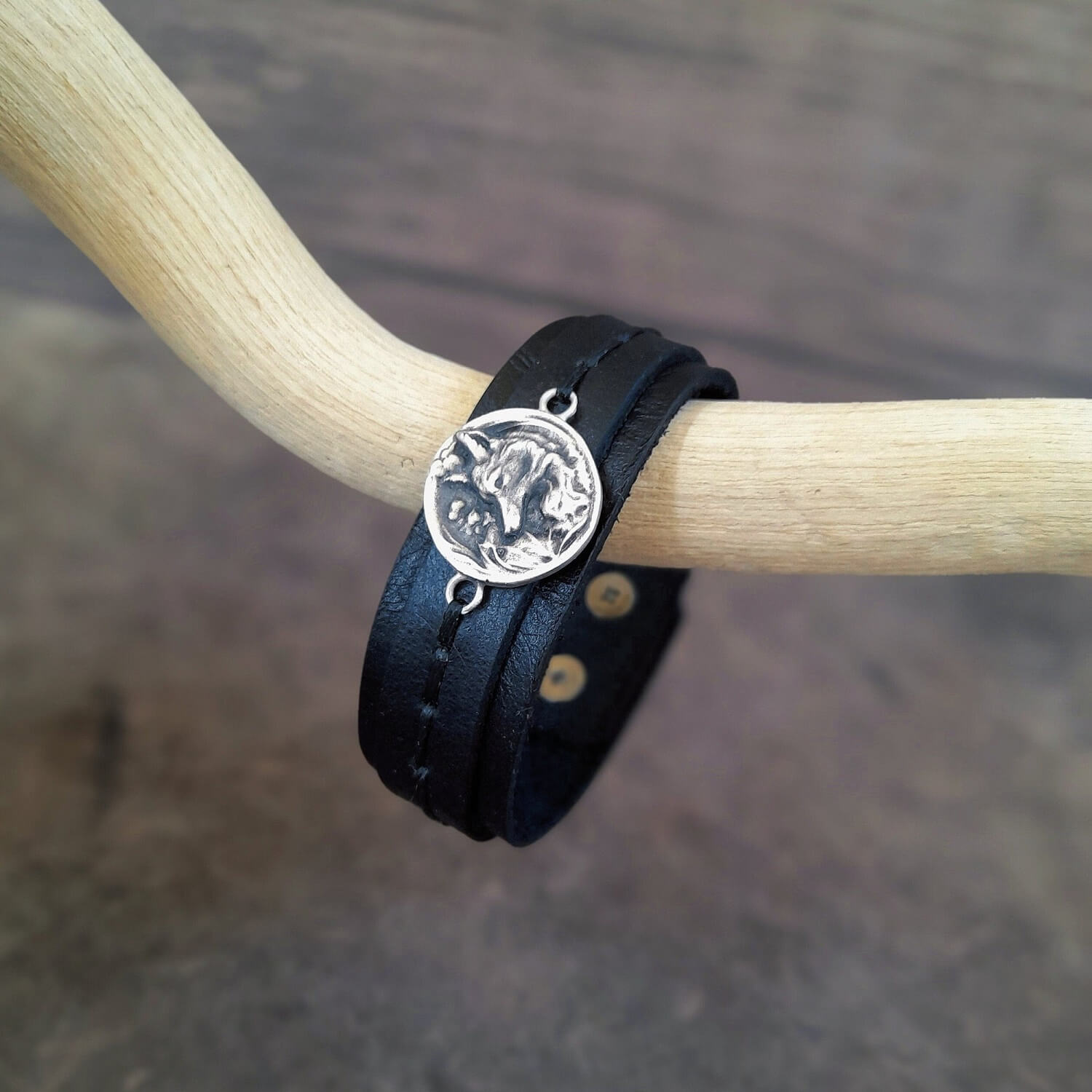 The Forest Fox Leather Bracelet, side view: A layered black full-grain leather cuff featuring a detailed handmade Silver 925 Forest Fox Charm.