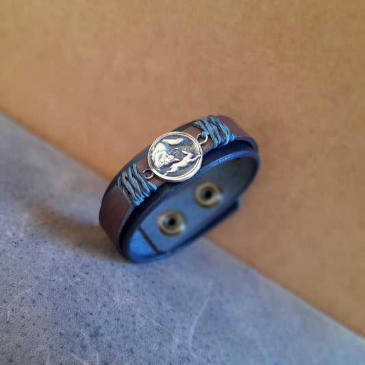 Hunting Wolf leather cuff with brass pendant and layered leather design