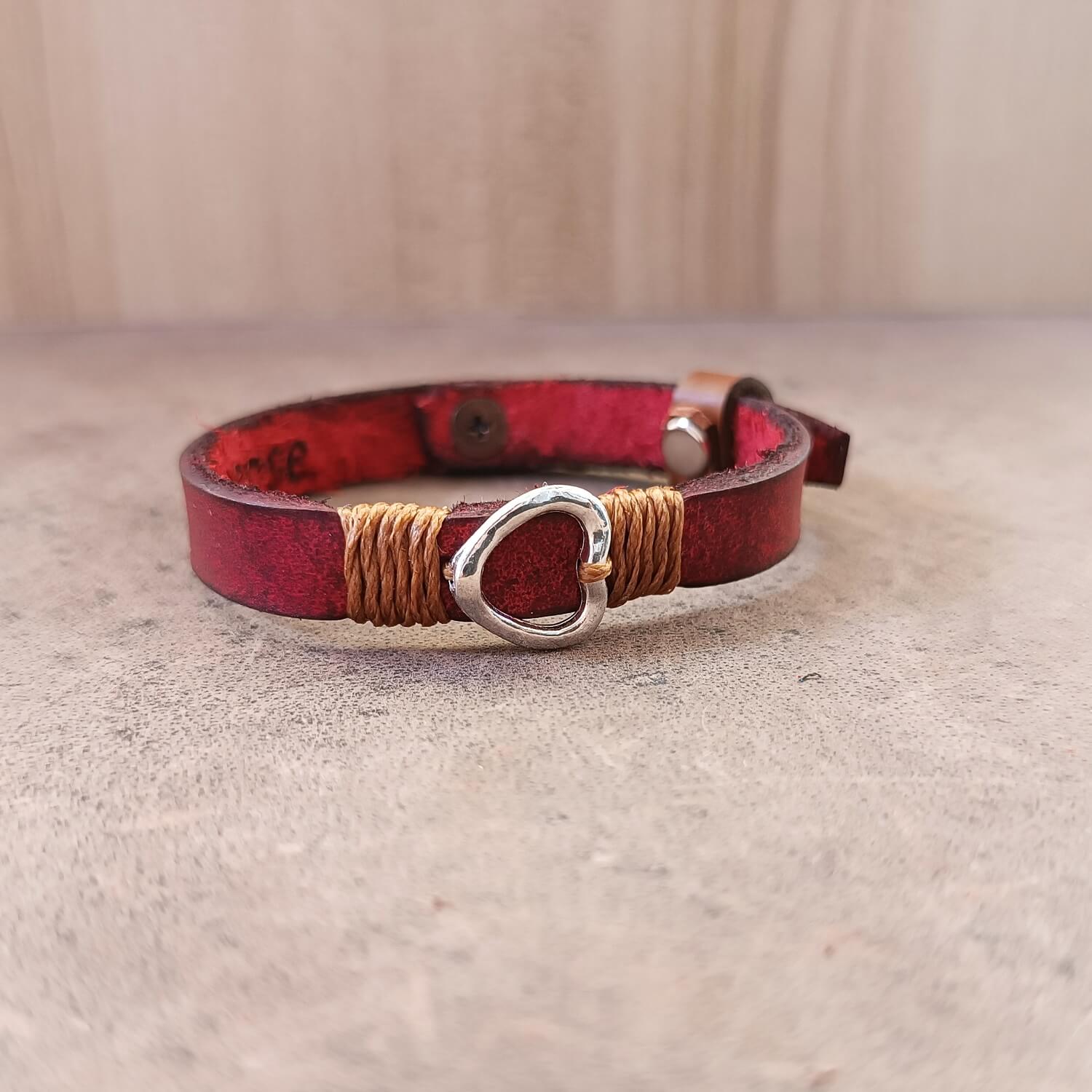 Inner Anchor Bracelet - Red Heart design. Handcrafted on red Crazy Horse leather, symbolizing self-love and joy - close up, side view with partial view of secret underside engraved area.