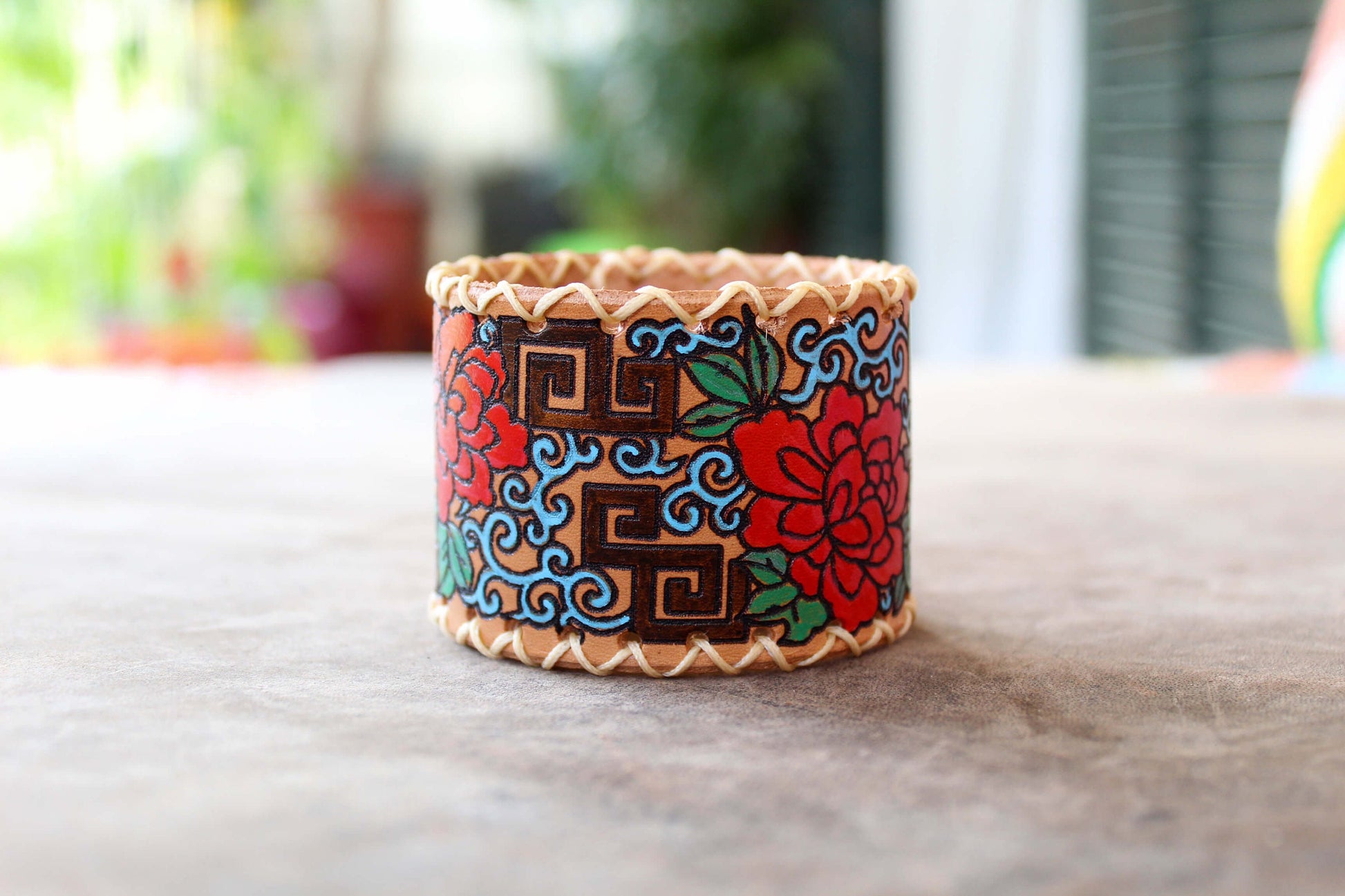 Extra wide leather cuff with hand painted Japanese floral abstract design on sunlight