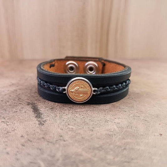 Leather bracelet with Archangel Michael pendant front view, showing rustic brown and black layered straps