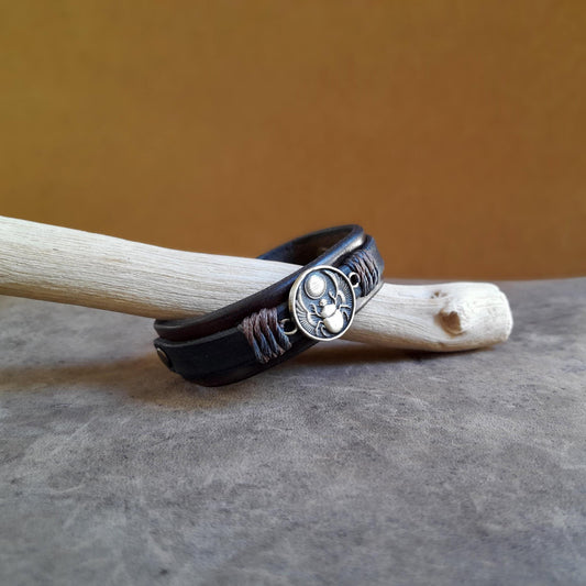 Leather bracelet with oxidized brass winged scarab pendant