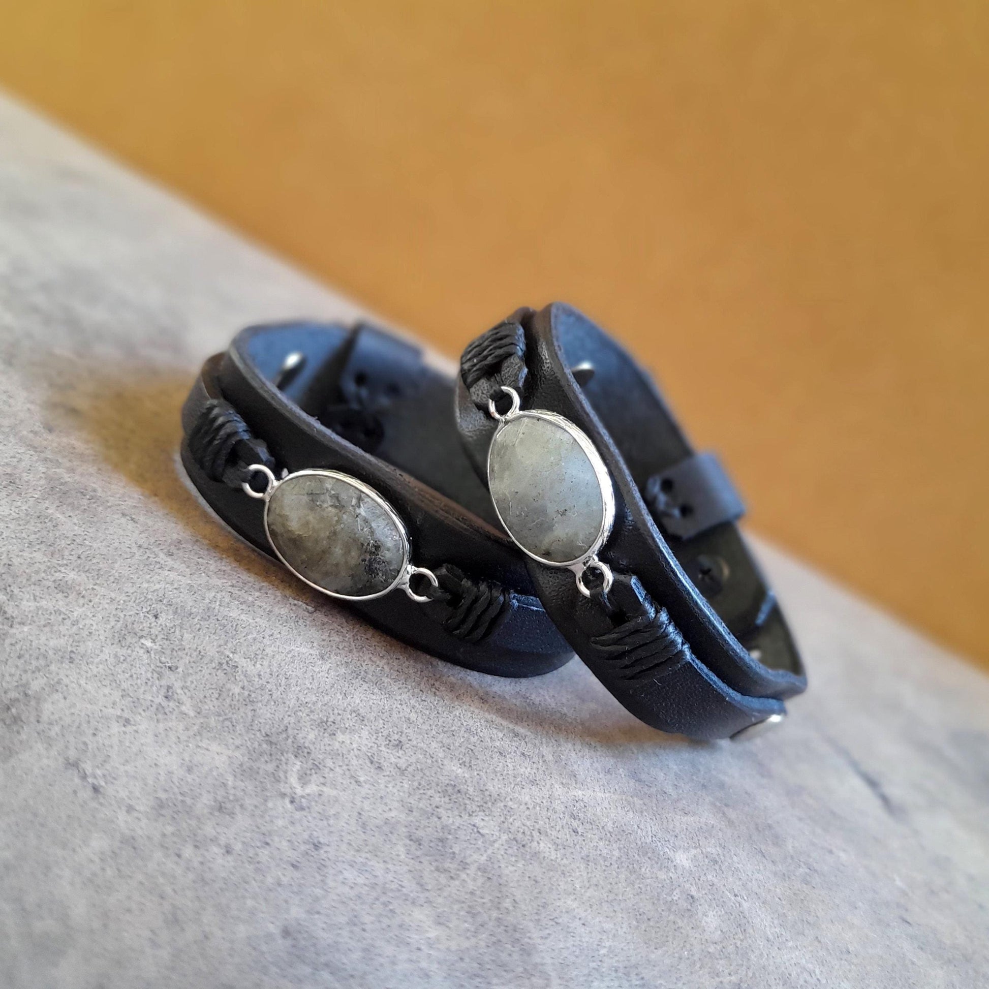 Detailed close-up of the gray Labradorite pendant on the Mystic Labradorite Wrap bracelet, showcasing its unique iridescent flash of colors.