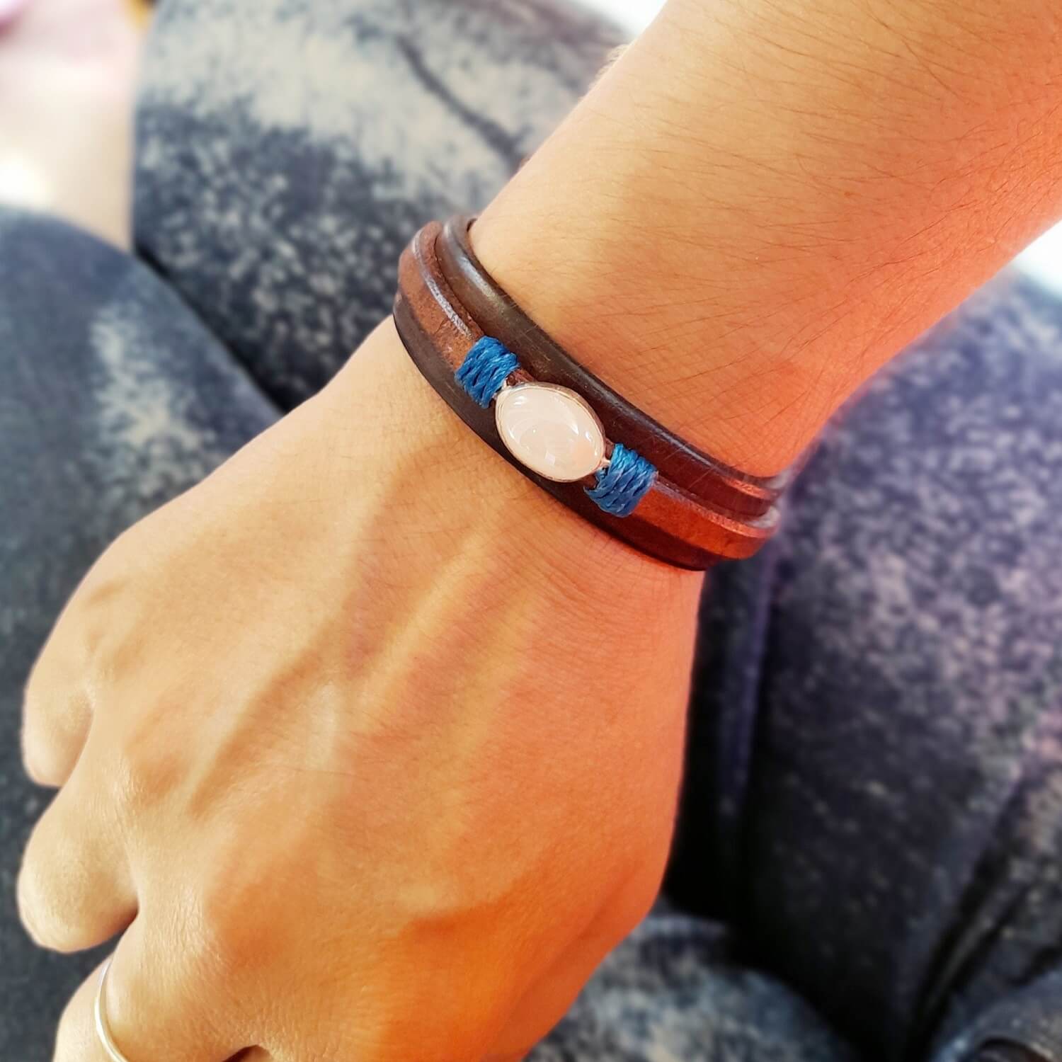 Natural Opal Leather Bracelet worn on a woman's wrist, showing how it drapes and the opal's shimmer.