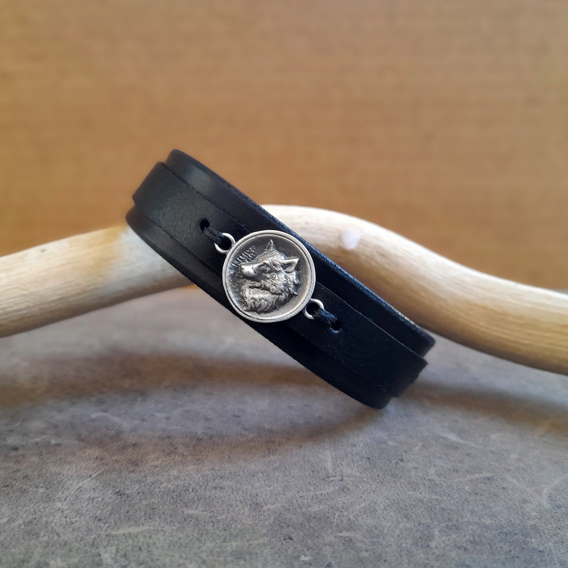 Nordic wolf leather bracelet, sleek and symbolic