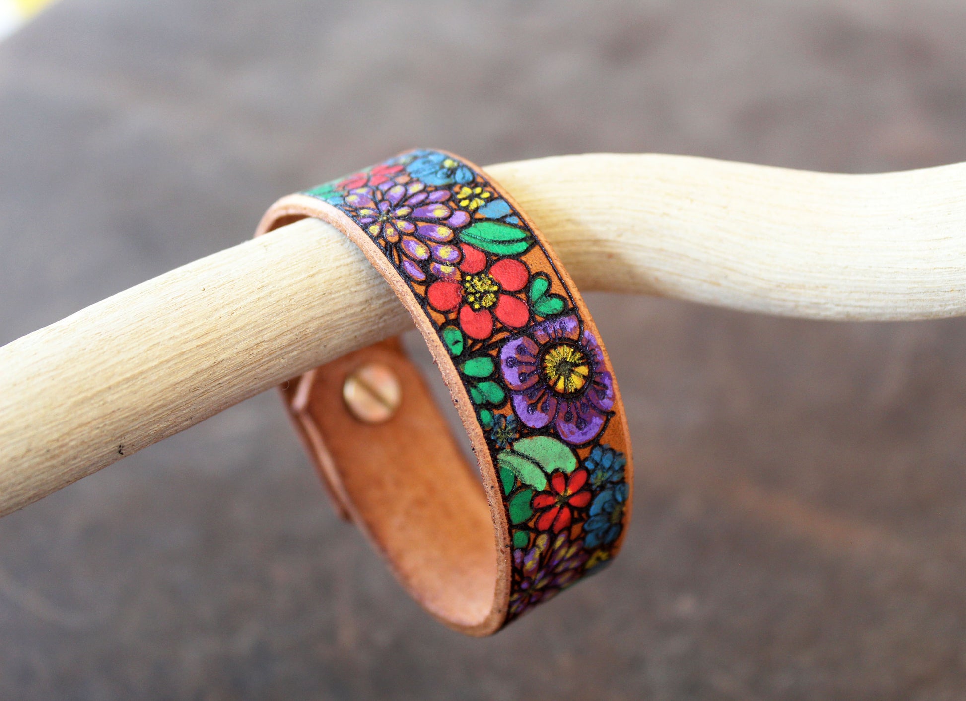 Other Angle Side view of Hand-Painted Flowers Bracelet, showing its 2cm width and hand-painted design wrapping around the leather band, revealing its depth.