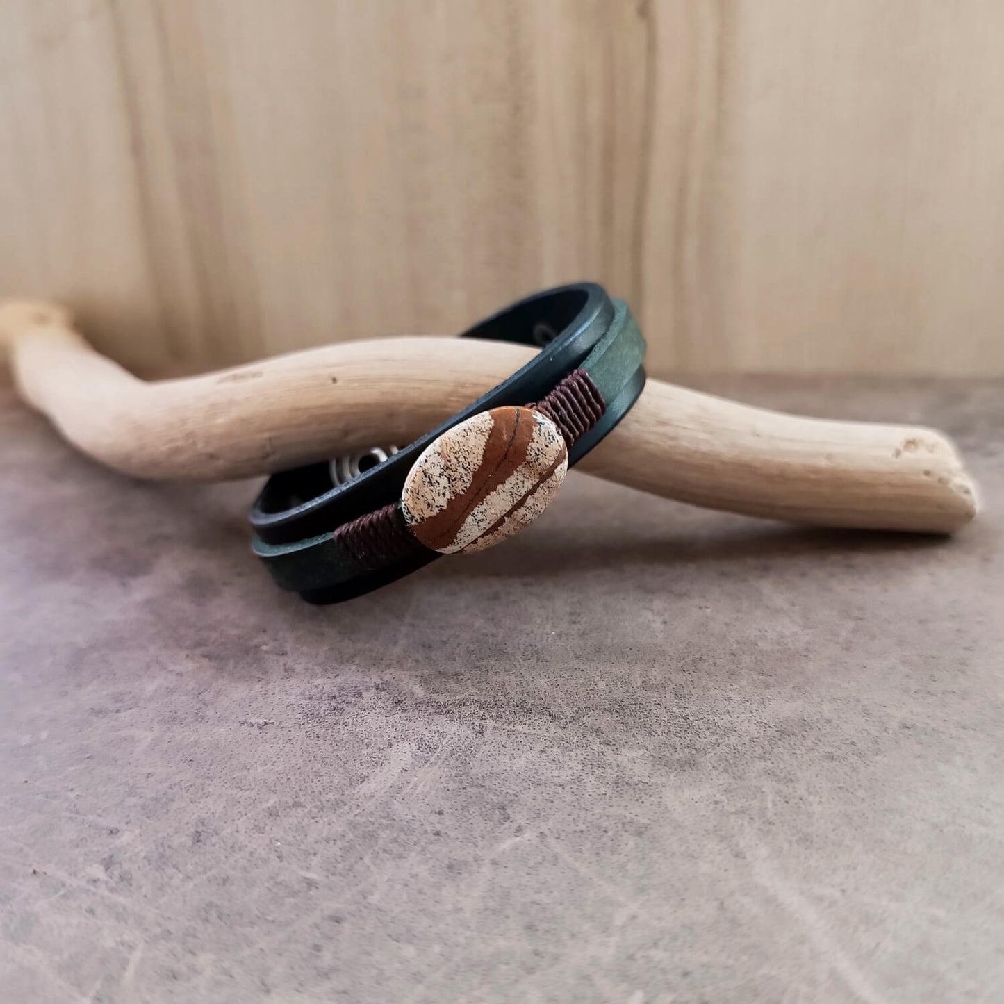 Black and green layered leather bracelet featuring a large oval natural picture jasper stone.