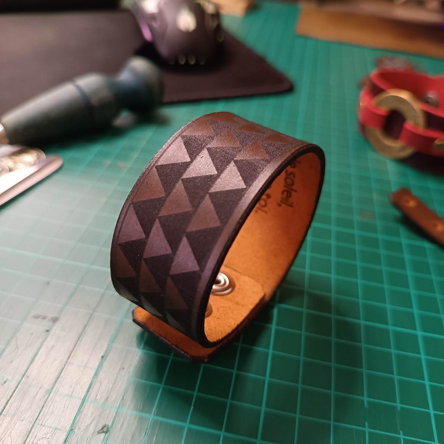 Custom Making of the Samoan Cuff on a green cutting mat