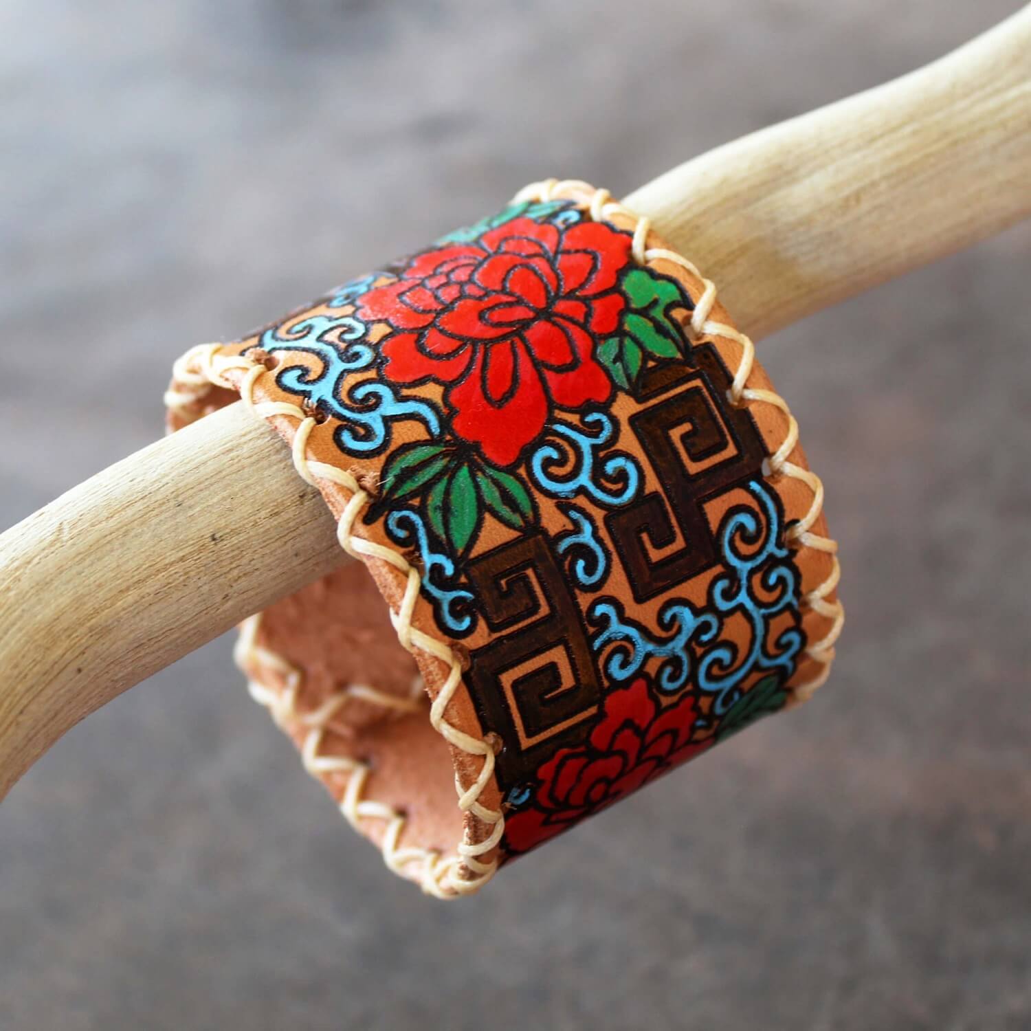 Extra wide leather cuff with hand painted Japanese floral abstract design on driftwood