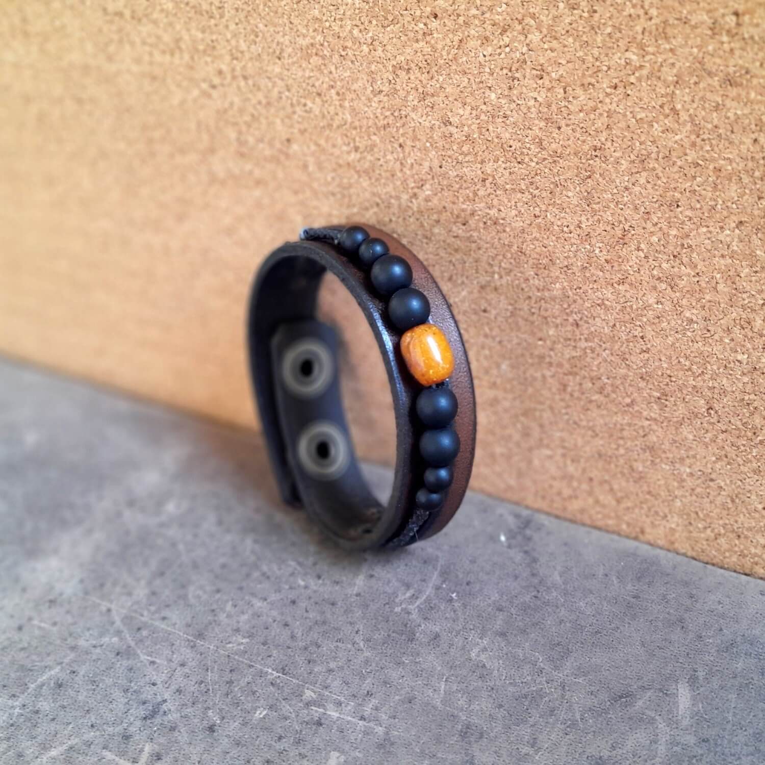 Close up Side view of the leather beaded bracelet, showing thickness and bead details