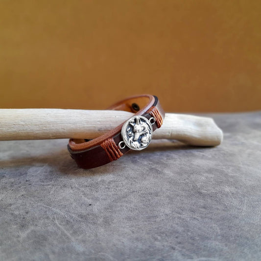 Side view of Arctic Fox Leather Bracelet, showcasing the two layers of honey brown and chestnut brown vachetta leather and the thickness of the band.