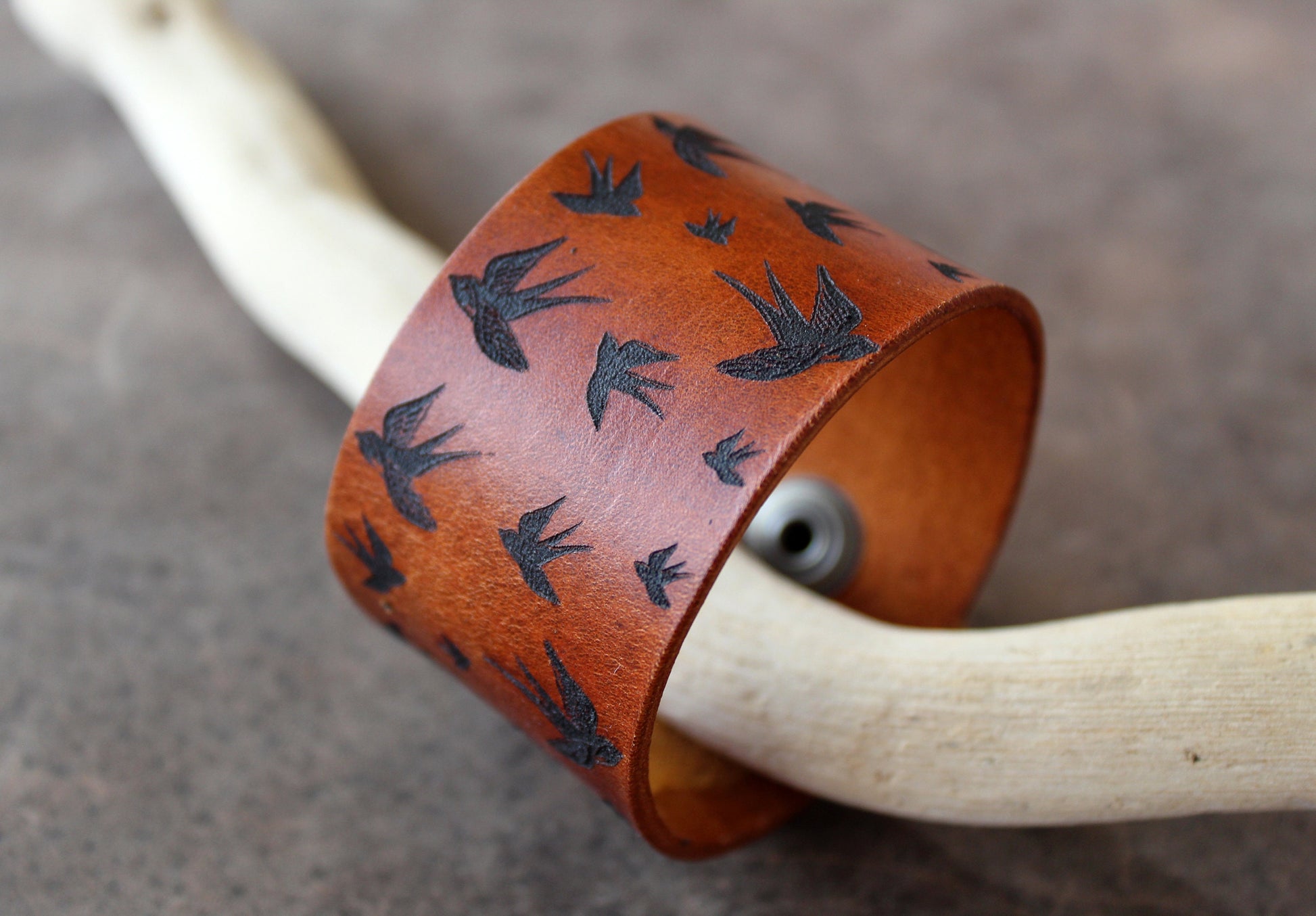 Side view of Flying Birds Wide Leather Cuff Bracelet, showcasing its sturdy 4cm width and quality full-grain leather.