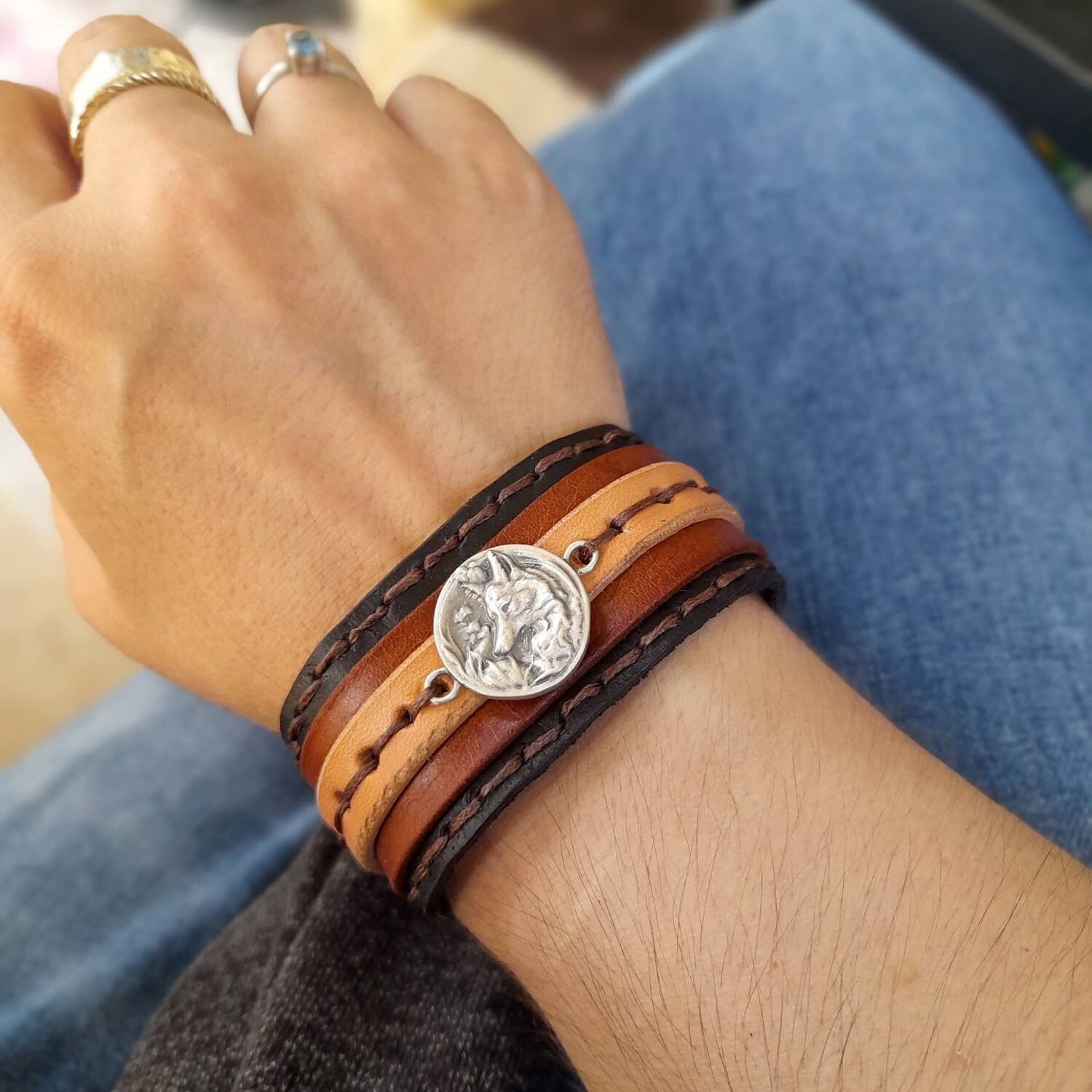 silver fox layered leather cuff worn on a woman's wrist