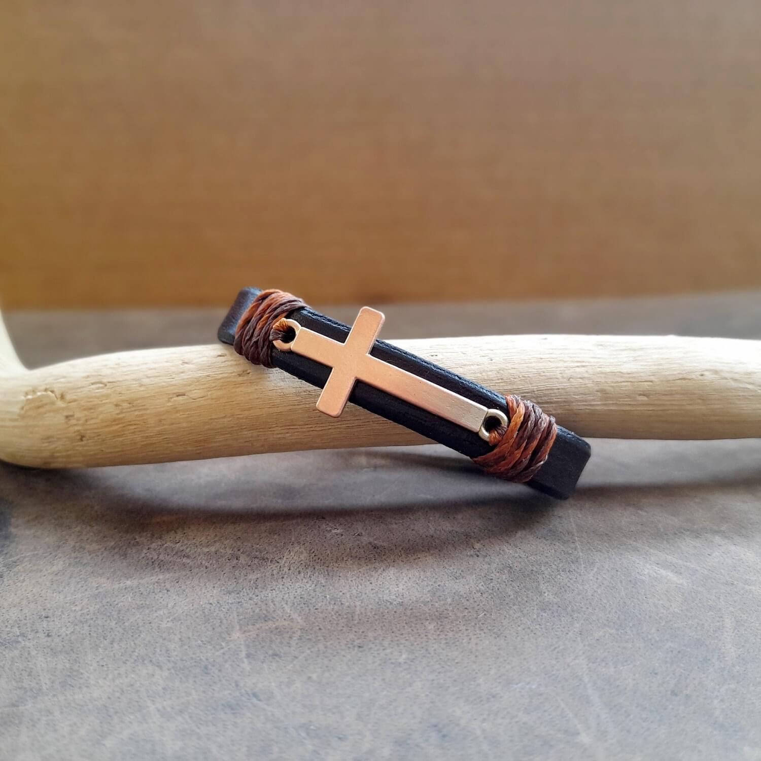 Slim leather band with rose gold cross, side view