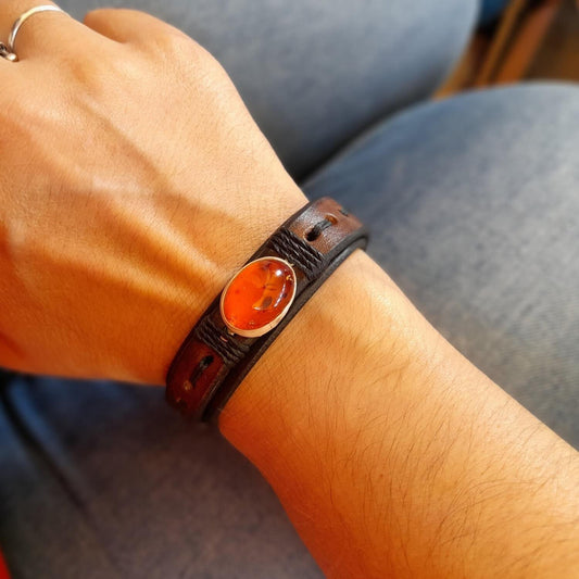 The Amber Time Capsule Bracelet worn on a wrist, demonstrating its comfortable fit, layered design, and rugged yet refined aesthetic and gernderless style.