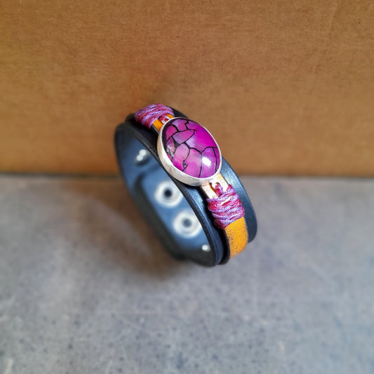 The Dragon Heart Bracelet: An OOAK leather cuff featuring a large Natural Purple Dragon Veins Agate cabochon set in hand-crafted Sterling Silver. Shows the full two-layered leather band.