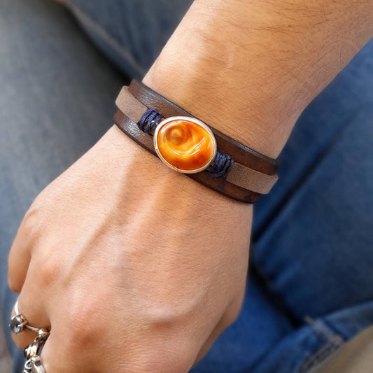 The 'Eye of the Sea' Bracelet worn on a wrist, demonstrating its layered design, comfortable fit, and versatile appeal for both men and women.