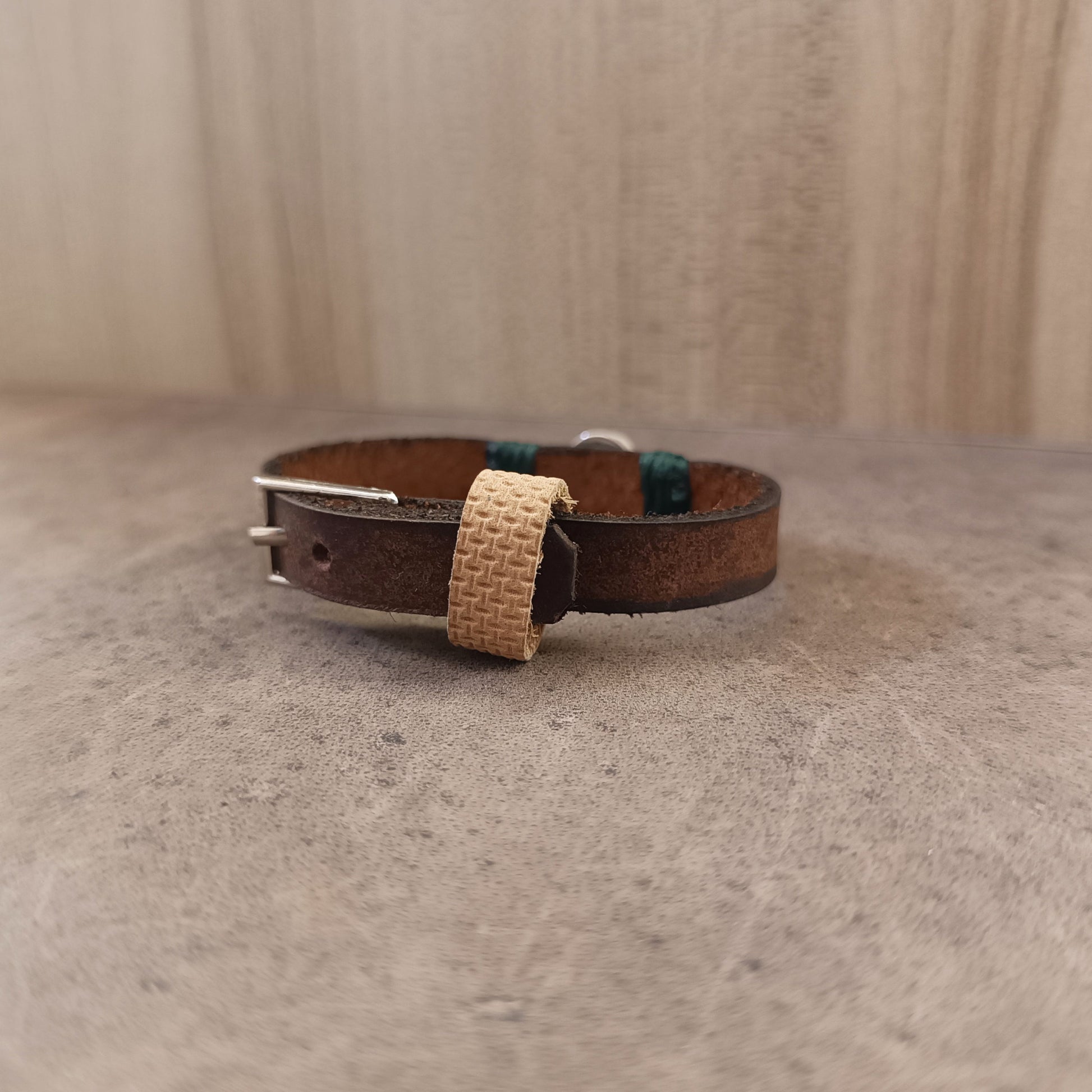 Close-up of the stainless steel buckle closure on The Forest Whisper Bracelet, showing its adjustable openings and secure design.