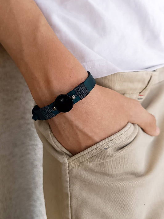 The Grounding Gaze bracelet worn on man's wrist, stacked or worn solo for everyday balance