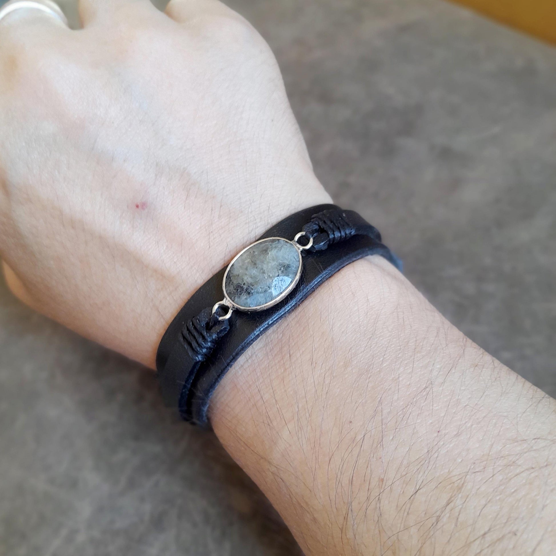 The Mystic Labradorite Wrap bracelet worn on a wrist, demonstrating its layered design, how it fits, and its bold, versatile style.