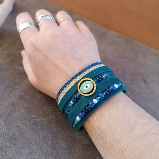 The Protector Cuff worn on a wrist, demonstrating its extra-wide design and how it creates the look of a full bracelet stack with a single piece.