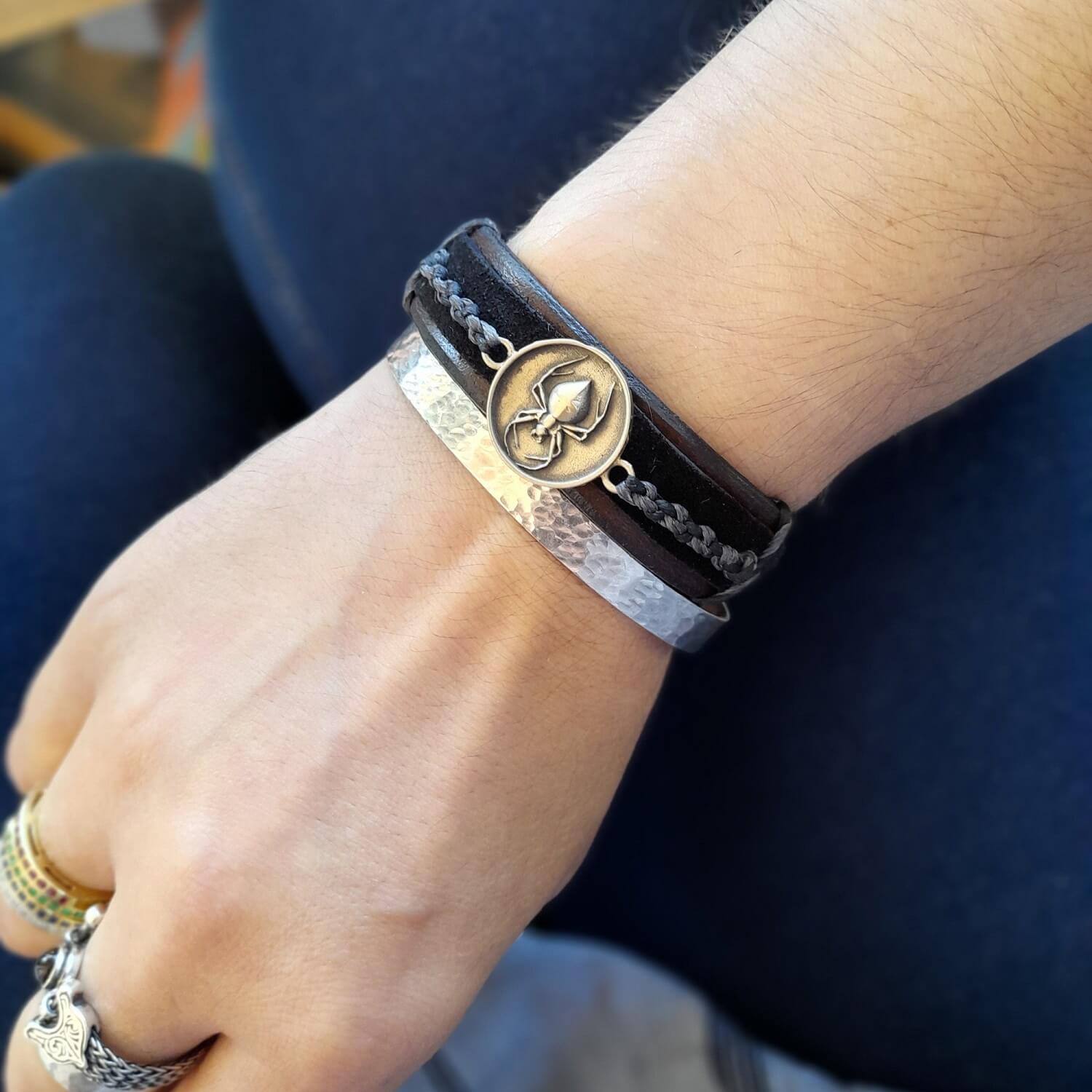 The Spider Ally Bracelet worn on a wrist, demonstrating its edgy style, comfortable fit, and how it subtly integrates into a personal look.