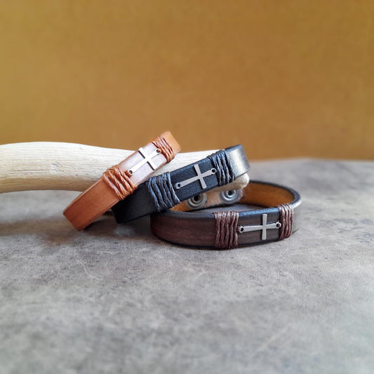 The Subtle Cross Bracelet group photo stacked, showcasing all three variations: Black, Dark Brown, Brown.