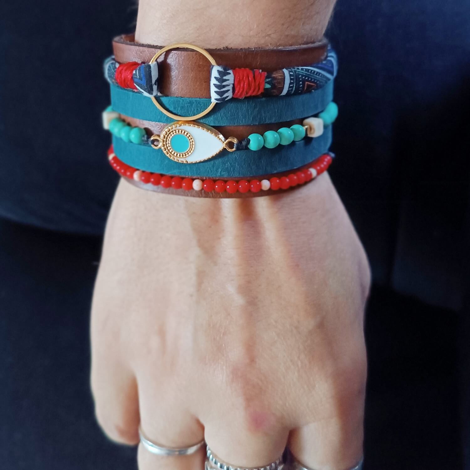 The Warrior Stack Extra Wide Ethnic Leather Cuff worn on a wrist, showcasing its bold, chunky presence, multi-strand appearance, and comfortable fit.