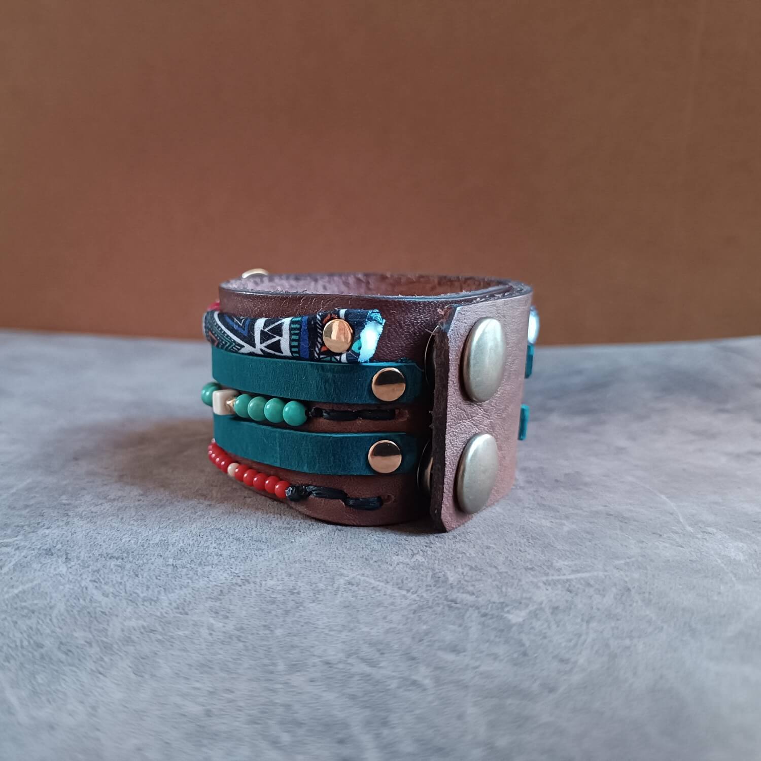 backside view of the warrior statc cuff, showing snap closures