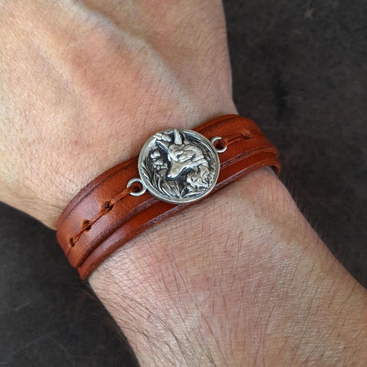 The Forest Fox Leather Bracelet worn on a wrist, demonstrating its stylish fit and how it adds a clever and independent statement to an outfit.