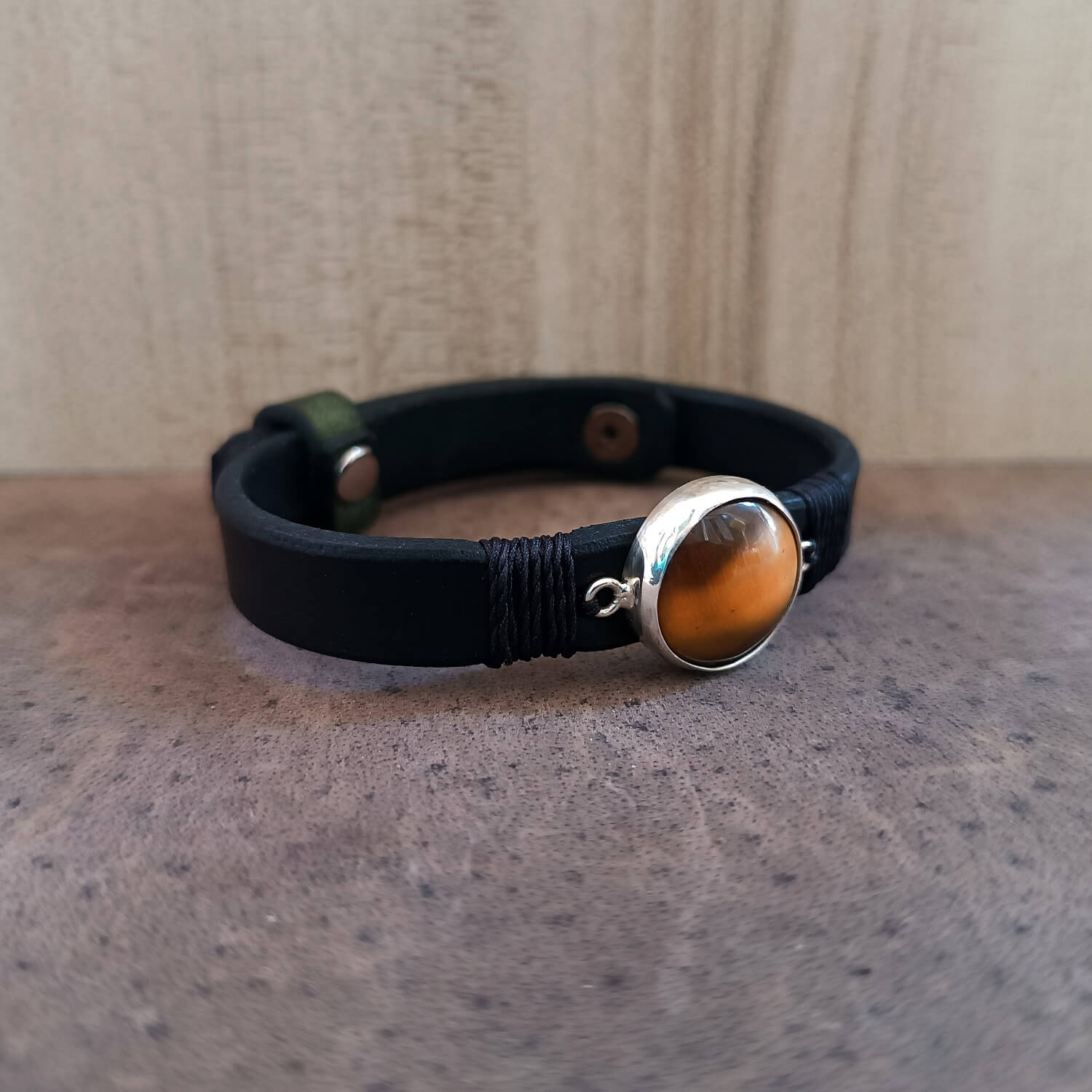 Black leather bracelet with Tiger's Eye stone on sterling silver pendant, front full view