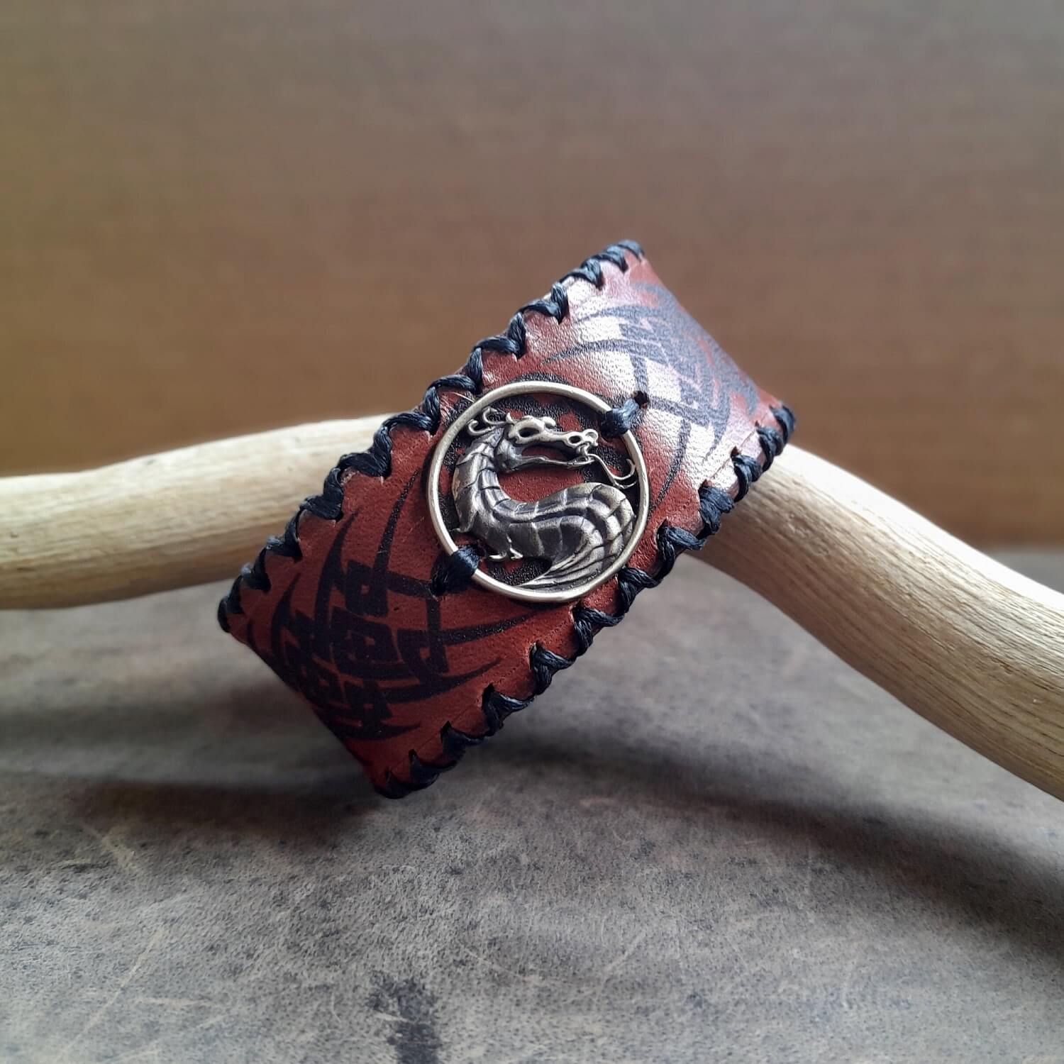 Tribal engraved leather bracelet with brass dragon centerpiece