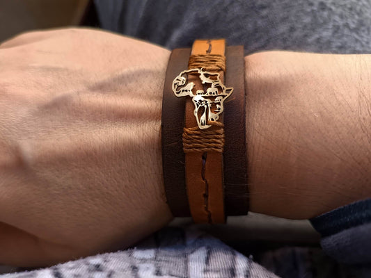 Brown leather bracelet with Africa map design on wrist