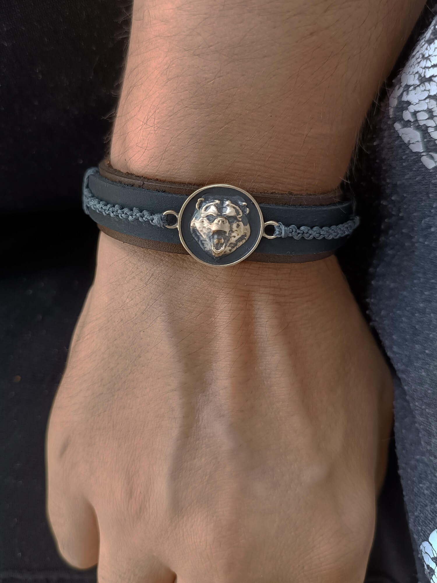 black bear leather bracelet worn on wrist