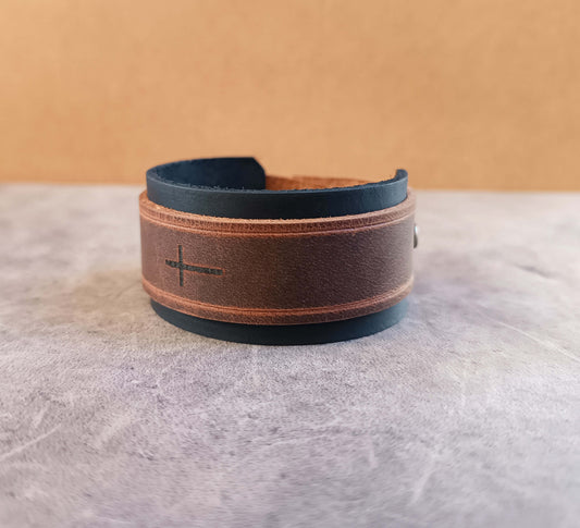 black brown leather cuff with engraved horizontal cross